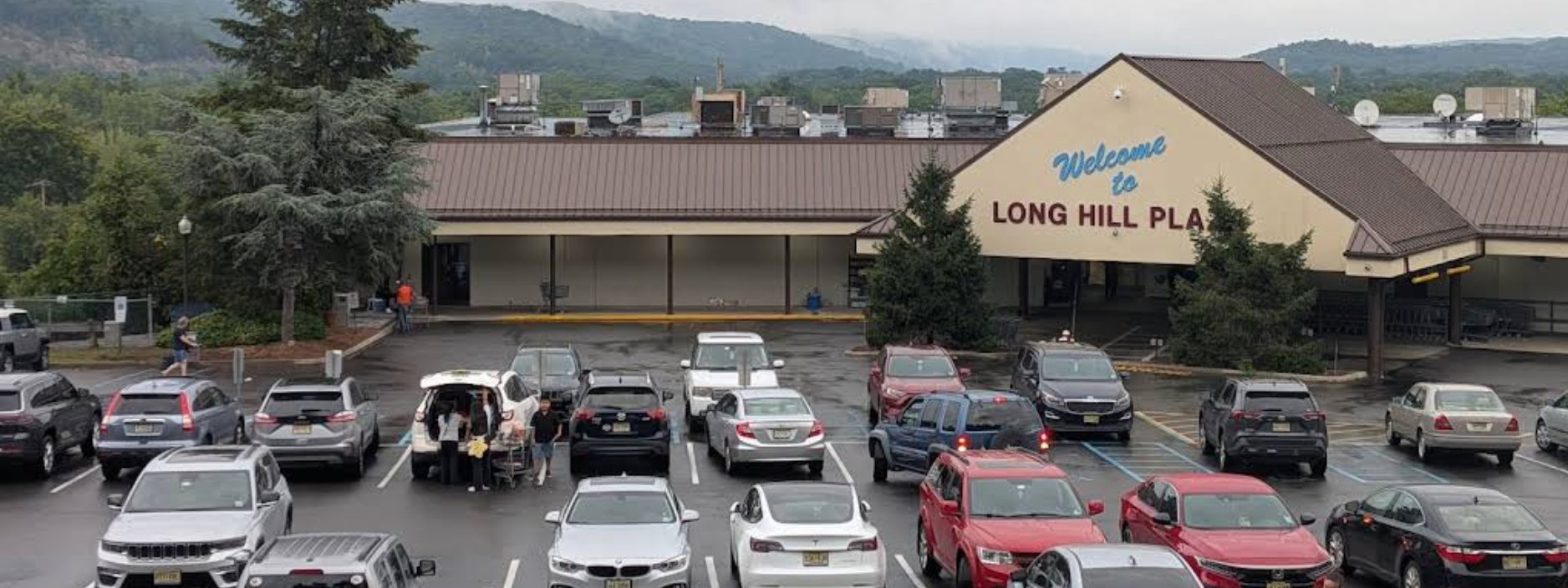 Long Hill Plaza — home of Long Hill Liquors, Oakland NJ, with the Long Hill ridge in the background